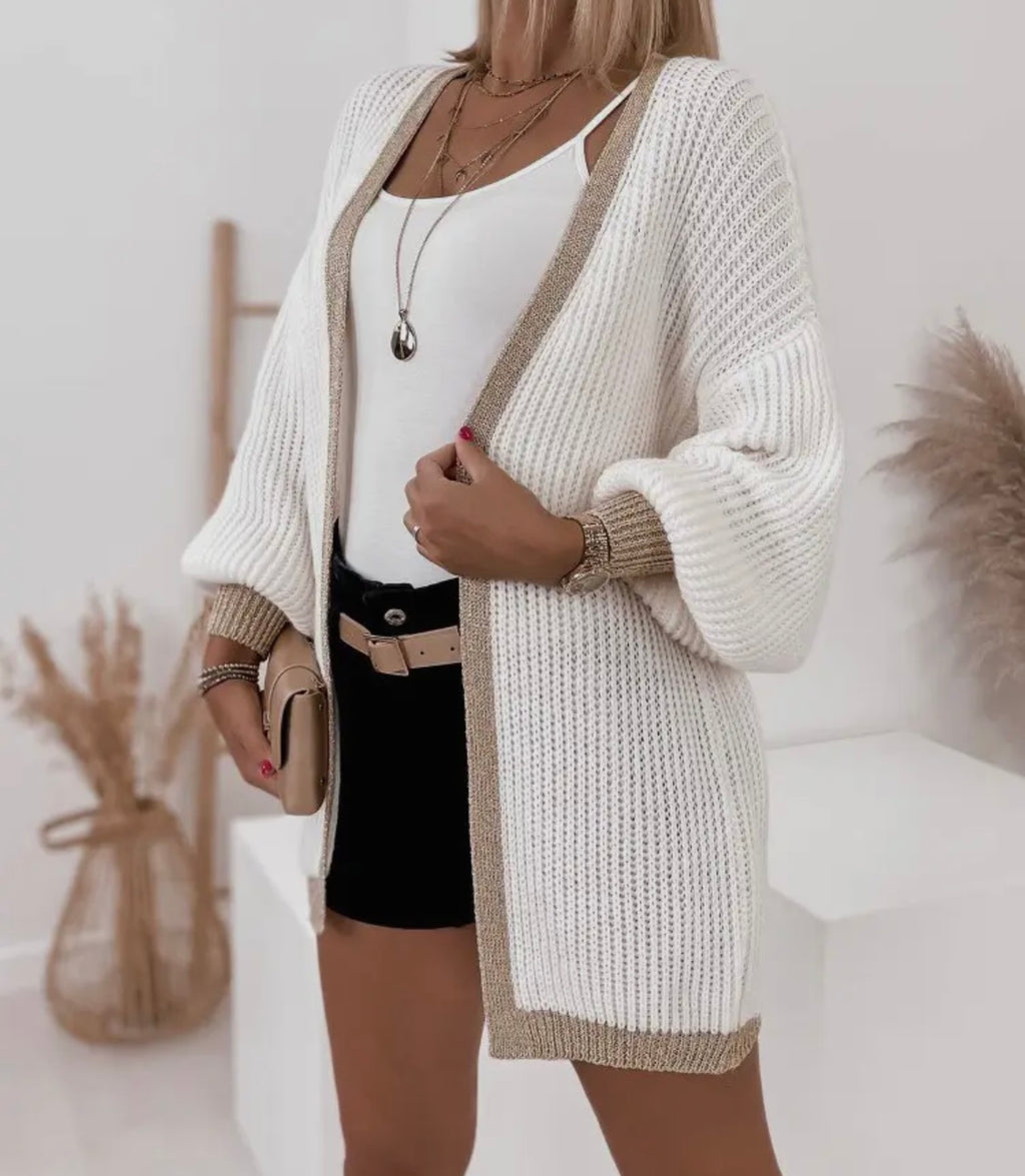 Lang strik cardigan med glimmer guldkant